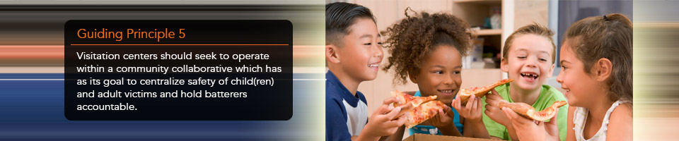 Four children smiling while eating pizza